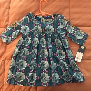 Teal OshKosh dress with pink and gold accents.